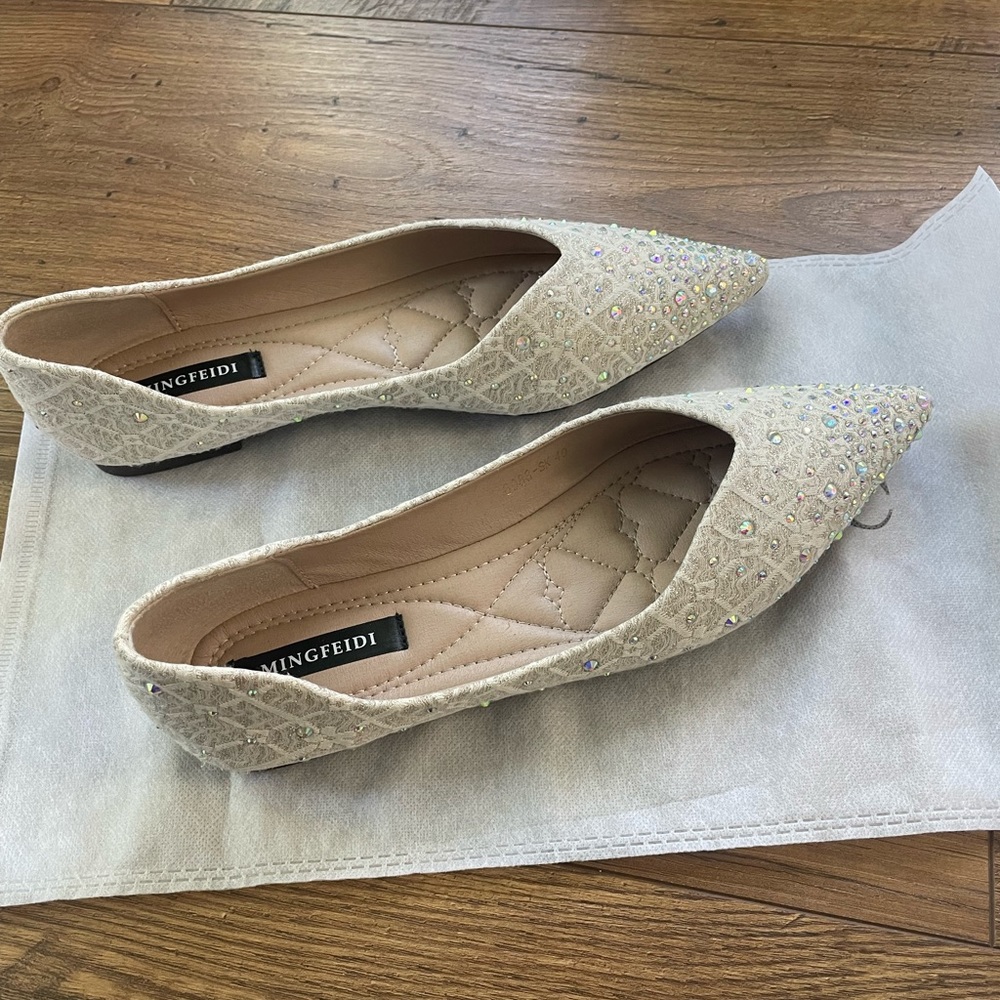 White linen and rhinestone ballet flats. Very well kept and only worn once.